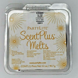 May include: A PartyLite Scent Plus Melts package. The clear plastic container holds a dark purple wax melt. The label includes the text "FIG TREE" and "Net 3.2 oz."