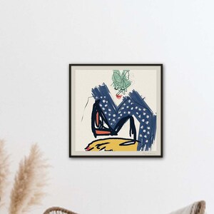 May include: A framed abstract art print with a blue, yellow, and green color scheme. The print features a stylized figure with a green leaf on its head.