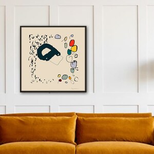May include: A framed abstract art print with black lines, colorful circles, and the text "Sigmund" in the bottom right corner.