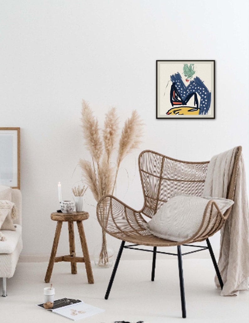 May include: A framed abstract art print with a blue, yellow, and green color scheme. The print features a stylized figure with a green leaf on its head.