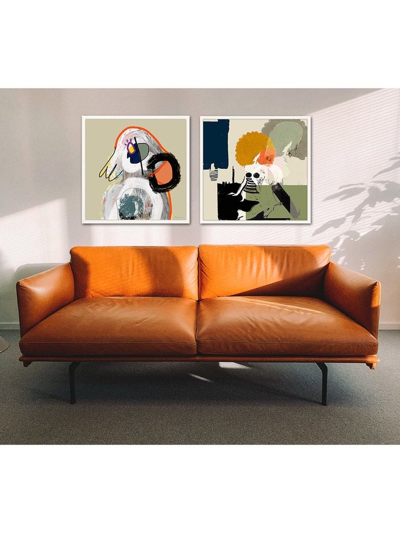 May include: Two framed abstract art prints featuring colourful geometric shapes and figures. The prints are hanging on a white wall above a brown leather sofa.
