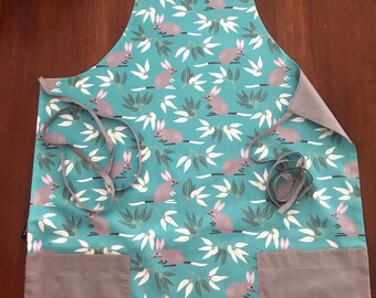 Apron: Jocelyn Proust 'Bilby' print,teal background,100% quilters cotton,grey cotton voile fully reversible,handmade,for protection & safety