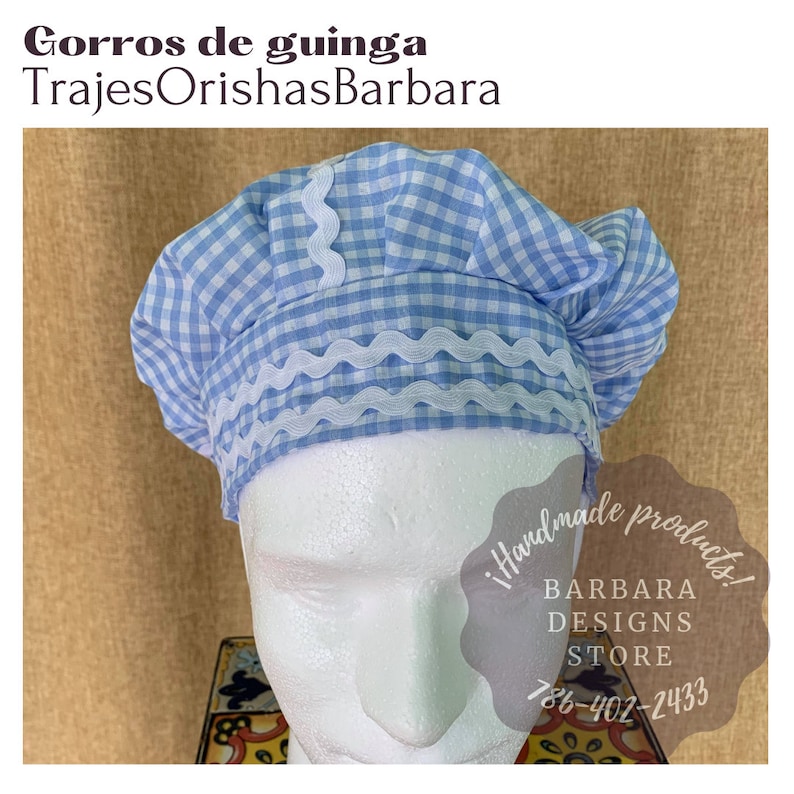 May include: A blue and white gingham fabric hat with a white scalloped trim. The hat is on a white mannequin head. The text "!handmade products! BARBARA DESIGNS STORE 786-402-2433" is visible in the image.