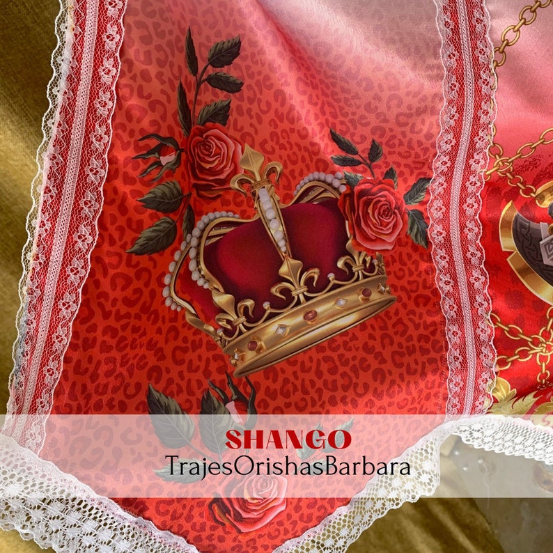 May include: A red and gold crown with a red rose and green leaves on a red and white leopard print background. The text "SHANGO" and "TrajesOrishasBarbara" is at the bottom of the image.