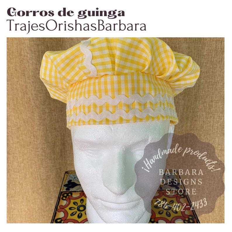 May include: Yellow and white gingham chef's hat with white scalloped trim. The hat is on a white mannequin head. The text "!Handmade products! BARBARA DESIGNS STORE 786-402-2433" is visible in the image.