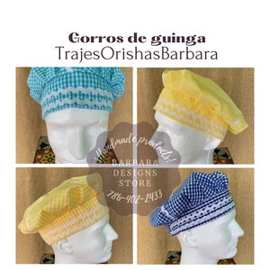 May include: Four gingham fabric chef hats in different colors. The hats are yellow, blue, turquoise, and white. The hats have a scalloped trim. The text "Gorros de guinga TrajesOrishasBarbara" is at the top of the image. The text "Handmade products! Barbara Designs Store 786-402-2433" is in the center of the image.