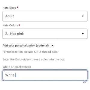 May include: A form with a drop-down menu for selecting hat sizes and colors. The selected options are "Adult" and "Hot pink". There is a text box for entering a personalization request, with the text "White" already entered.