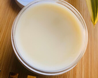 May include: A clear glass jar filled with a thick, white cream.
