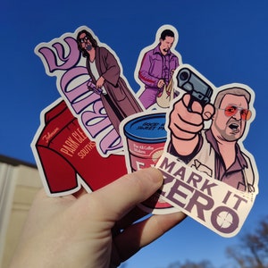 May include: A collection of colourful stickers featuring various characters and designs. The stickers include a red and white sticker with the text "Johnson Park CLE Souths", a blue and white sticker with the text "Good Morning Sweet Passion", a white sticker with the text "Mark It Zero", and a sticker with a cartoon character holding a gun.