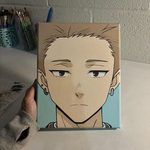 May include: A hand-painted canvas art piece featuring a stylized anime-style portrait of a young person. The artwork showcases a light skin tone, brown hair, and a neutral expression. The background is a light blue.