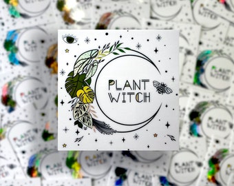 May include: White sticker with a black crescent moon and the text "PLANT WITCH" inside. The moon is surrounded by green and yellow leaves, a bee, and stars.