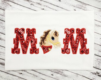 May include: Red and white bandana print letters "MOM" with a brown and white horse head in the middle. The horse is wearing a red bandana with a white star.