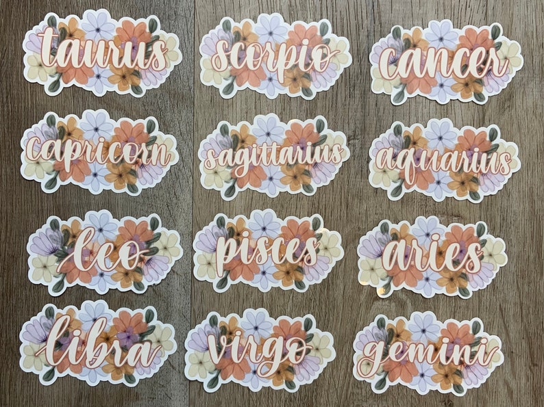 May include: Twelve floral stickers featuring the zodiac signs: Taurus, Scorpio, Cancer, Capricorn, Sagittarius, Aquarius, Leo, Pisces, Aries, Libra, Virgo, and Gemini.