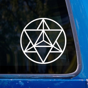 May include: White geometric design sticker featuring a complex star-like pattern within a circle. The design is composed of interconnected triangles and lines, creating a symmetrical and intricate shape. The sticker is displayed on a blue surface, likely a vehicle window.