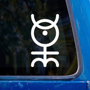 May include: White vinyl decal featuring a stylized symbol. The design includes a circle with a dot, topped by curved lines, and a base with three curved shapes. The decal is displayed on a window with a blue vehicle frame visible.