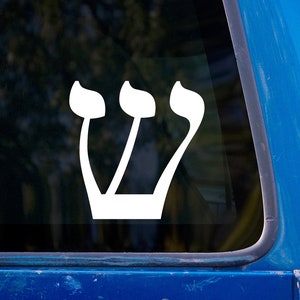 May include: White vinyl decal of the Hebrew letter Shin, a symbol of the divine presence, on a blue car window.