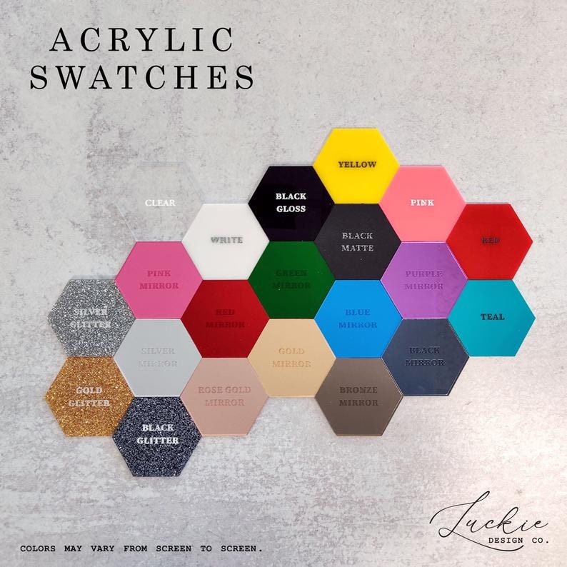 May include: Acrylic swatches in various colors and finishes, including clear, white, black gloss, black matte, pink, red, green mirror, blue mirror, gold mirror, rose gold mirror, silver glitter, silver mirror, black mirror, purple mirror, teal, bronze mirror, and yellow. The text "Acrylic Swatches" is at the top of the image. The text "Colors may vary from screen to screen." is at the bottom of the image. The text "Luckie Design Co." is at the bottom right of the image.