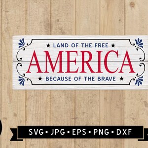 May include: A white wooden sign with blue and red accents. The sign reads "Land of the Free, America, Because of the Brave".
