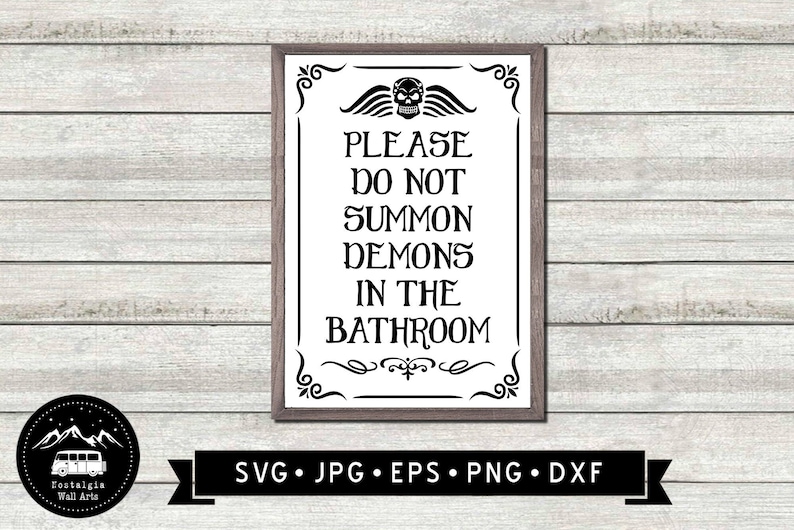May include: A black and white sign with a skull and crossbones graphic and the text "PLEASE DO NOT SUMMON DEMONS IN THE BATHROOM". The sign is framed in a brown frame with decorative flourishes.