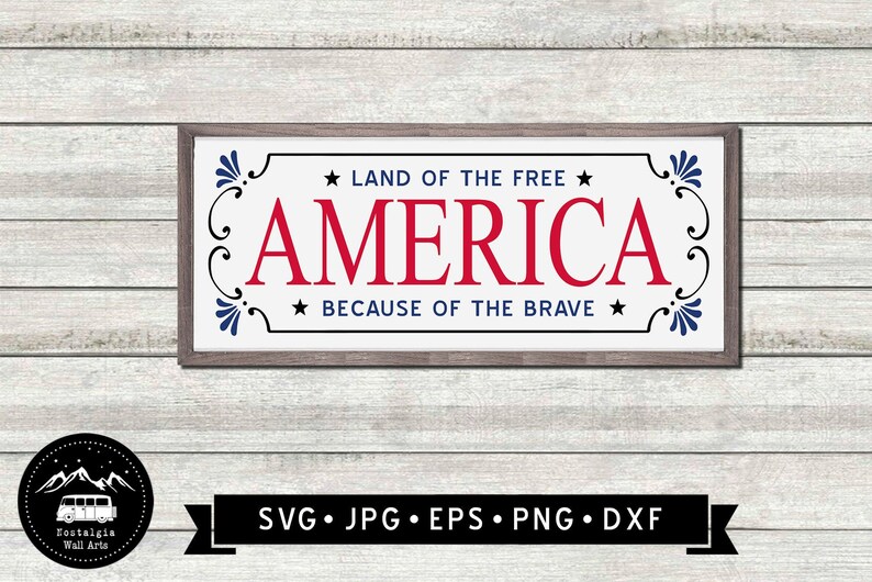 May include: A white sign with a brown frame and blue and red lettering. The sign reads "Land of the Free - America - Because of the Brave".