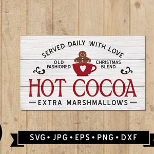 May include: A white wooden sign with the words "SERVED DAILY WITH LOVE" and "HOT COCOA" in red. A gingerbread man sits atop a red mug. The sign also includes the text "EXTRA MARSHMALLOWS".