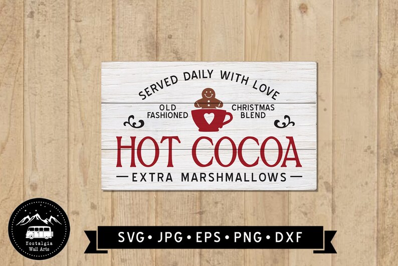 May include: A white wooden sign with the words "SERVED DAILY WITH LOVE" and "HOT COCOA" in red. A gingerbread man sits atop a red mug. The sign also includes the text "EXTRA MARSHMALLOWS".