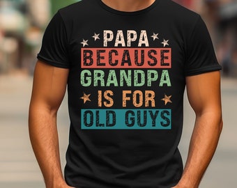 May include: Black t-shirt with a vintage-style graphic that reads "Papa Because Grandpa Is For Old Guys". The graphic features stars and colorful text.