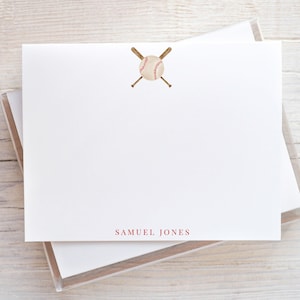 May include: White stationery with a baseball and crossed bats illustration. The baseball is light beige with red stitching. The text "SAMUEL JONES" is printed in red at the bottom of the stationery.