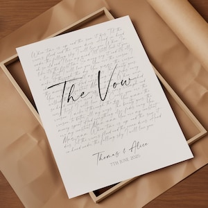 a printed document titled "The Vow" with handwritten text, placed on a wooden surface.