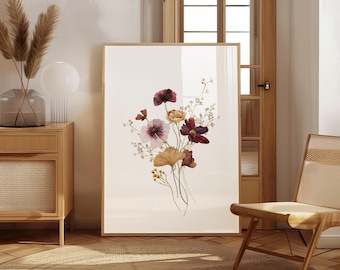 May include: A vertical rectangular framed wall art print featuring a watercolor illustration of a wildflower bouquet. The arrangement includes deep red, soft pink, and golden yellow blossoms with delicate stems and leaves on a plain white background.