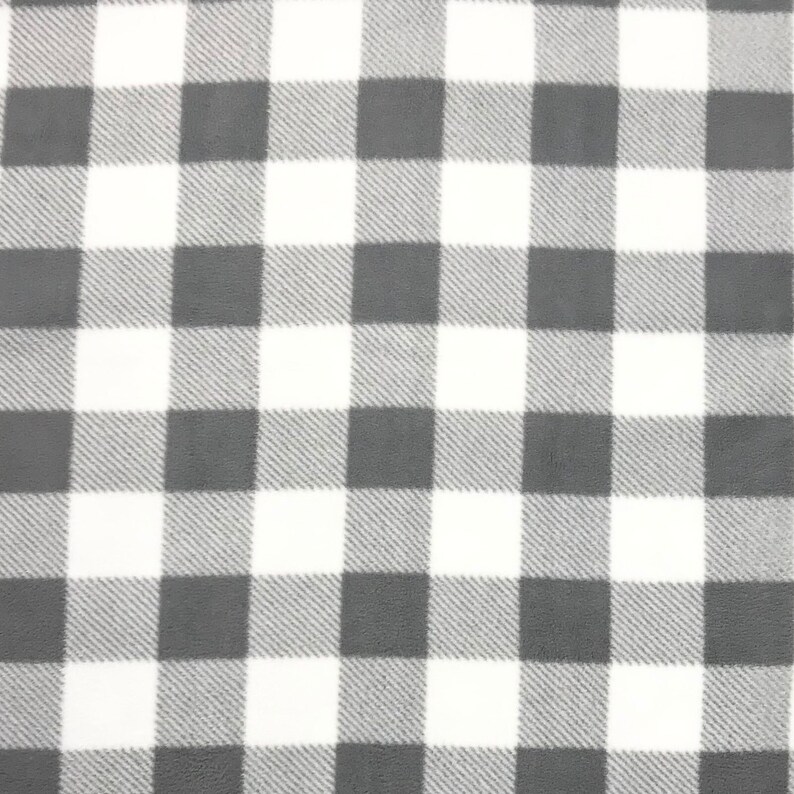 Puede incluir: Una tela a cuadros gris y blanca con una textura suave y peluda.