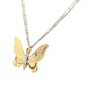 May include: A gold butterfly pendant necklace with a fine chain. The butterfly features detailed wing patterns and a line of small, sparkling stones. The necklace is displayed against a white backdrop.