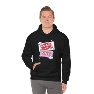 May include: Black hooded sweatshirt with a white and pink graphic of two soap bars with the text "Papa Zote" on them.