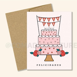 Könnte beinhalten: Eine rosa und weiße Hochzeitstorte mit roten Punkten und Blumen. Die Torte ist mit einem Banner verziert, auf dem "HASTA QUE" und "Mr & Mrs!" in roten Buchstaben stehen. Die Karte sagt auch "FELICIDADES" in roten Buchstaben.