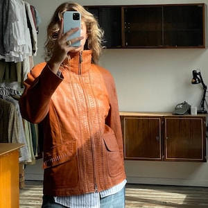 Vintage 90s burnt orange leather jacket with a high collar