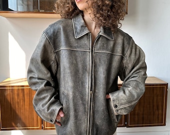 Vintage distressed leather bomber jacket in black with shades