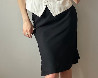 Falda icónica vintage en negro, falda clásica hasta la rodilla