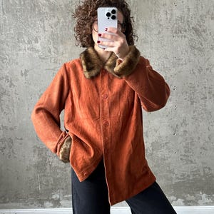 Vintage 90s burnt orange leather jacket with fur collar