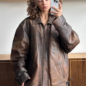 Vintage oversized extra-large faded leather jacket in brown