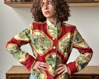 May include: A red and cream patterned jacket with a mandarin collar and button closure. The jacket features a repeating pattern of golfers and golf courses.