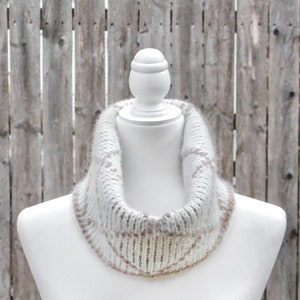 Cream and brown reversible Tunisian crochet cowl, worn folded over on mannequin with right side showing from front.