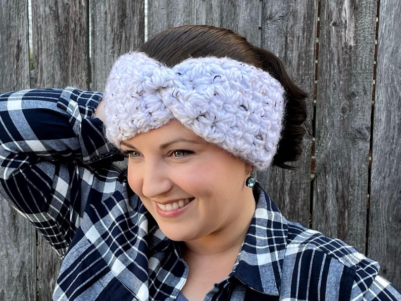 White Tweed Chestnut Crochet Earwarmer and Headband modelled on smiling dark haired woman.