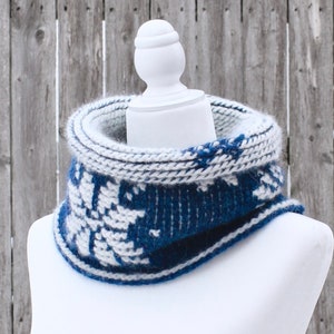 Dark Blue reversible Tunisian Crochet Cowl with white snowflake motif on mannequin, viewed from the side.