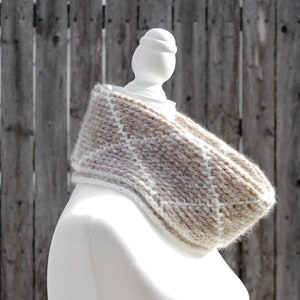 Cream and brown reversible Tunisian crochet cowl, worn folded over on mannequin in profile with reverse side showing.