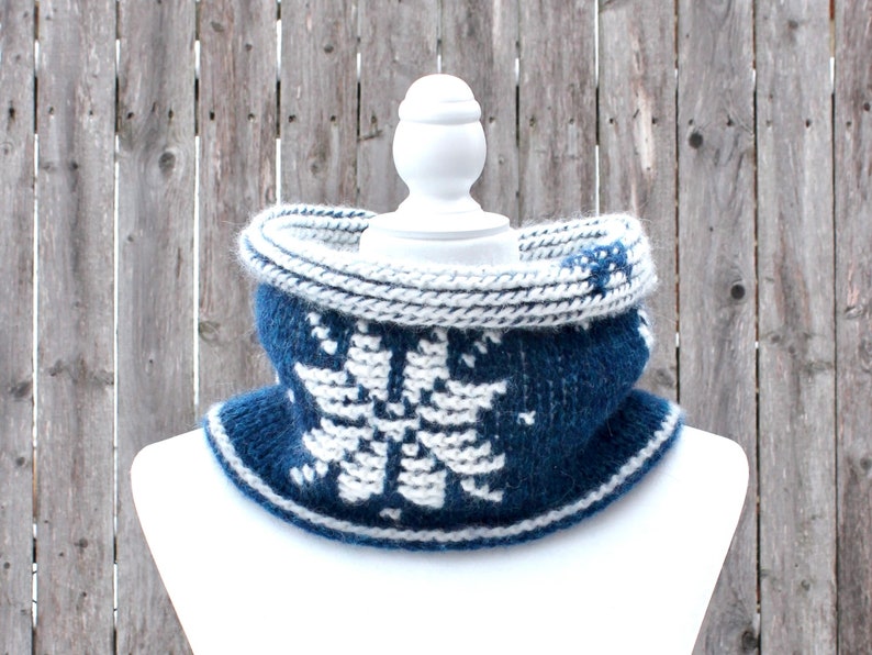 Dark Blue reversible Tunisian Crochet Cowl with white snowflake motif on mannequin, viewed from the front.