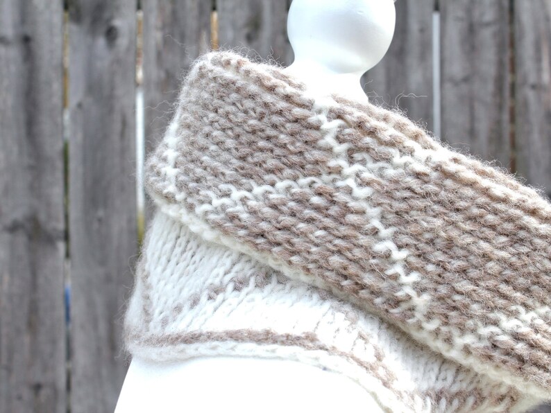 Cream and brown reversible Tunisian crochet cowl, worn folded over on mannequin in profile.
