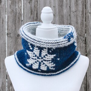 Dark Blue reversible Tunisian Crochet Cowl with white snowflake motif on mannequin, viewed from the front with top folded over.