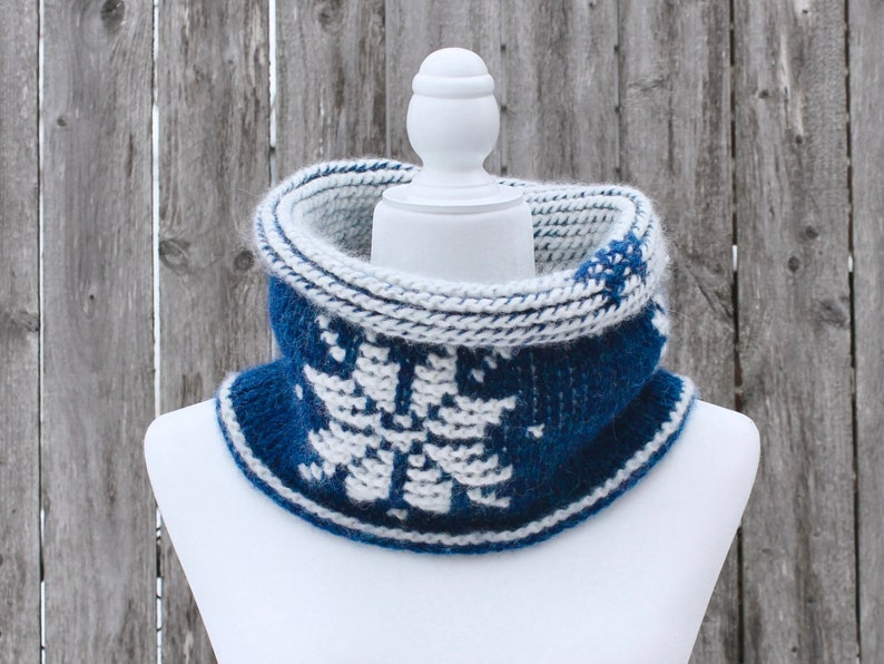 Dark Blue reversible Tunisian Crochet Cowl with white snowflake motif on mannequin, viewed from the front with top folded over.