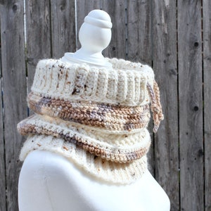 Neutral Cream tweed crochet cowl with drawstring from the side on a mannequin