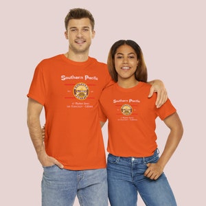 Happy rail enthusiast couple wearing Orange/Blue Southern Pacific Railway train t-shirts